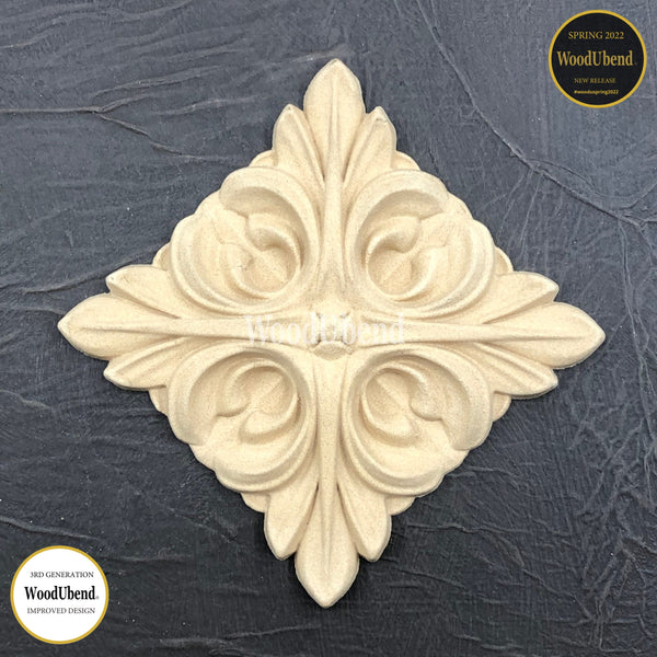 A decorative molding, no WUB6047.  The molding features a square with intricate centre piece design, adding a beautiful and sophisticated touch when added to a piece of furniture. Can be positioned in a square or diamond position.  Woodubend is a type of decorative wood molding that can be used to add a unique and elegant touch to furniture, cabinetry, and other woodworking projects.